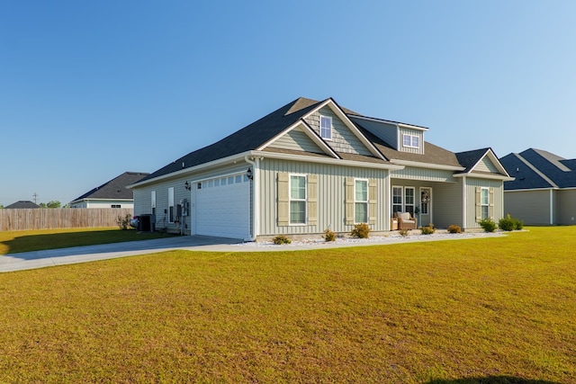 craftsman inspired home with cooling unit, driveway, fence, board and batten siding, and a front yard