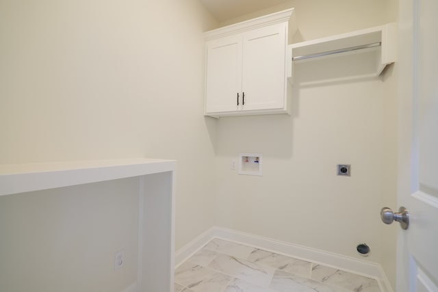 laundry area with hookup for an electric dryer, cabinets, and hookup for a washing machine