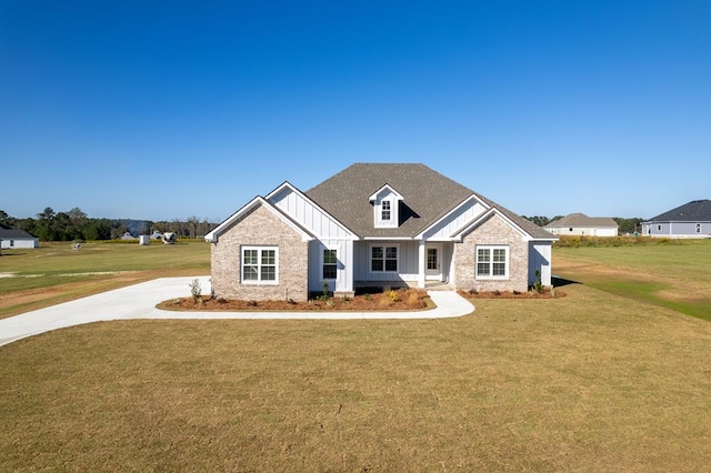 craftsman-style house with a front lawn