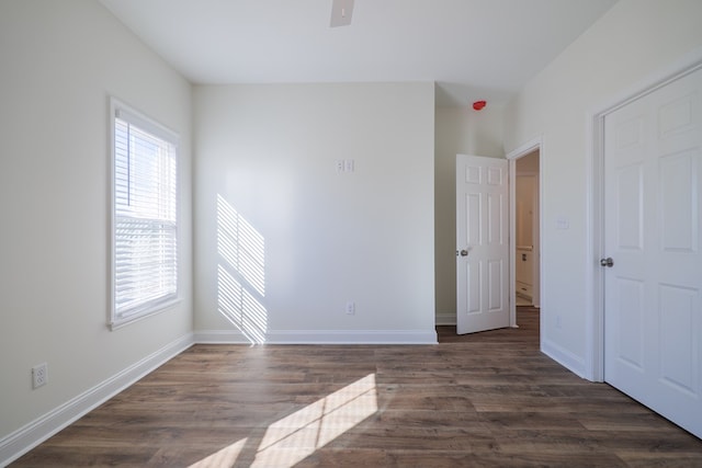 unfurnished room with dark hardwood / wood-style floors