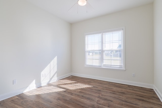 empty room featuring dark hardwood / wood-style flooring