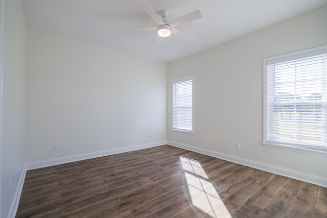 unfurnished room featuring dark hardwood / wood-style floors and ceiling fan