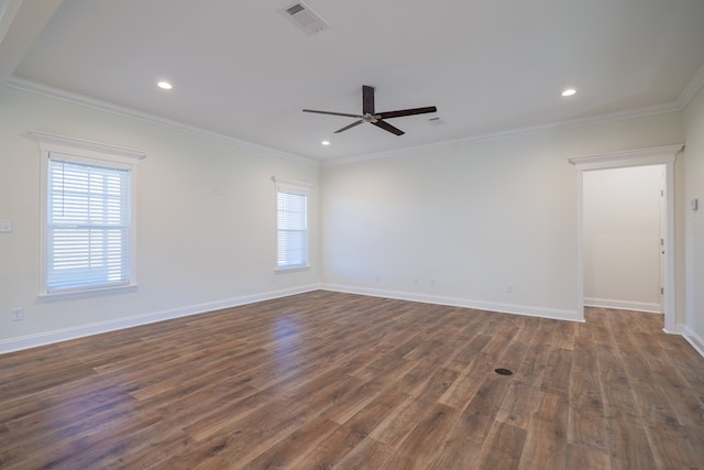 unfurnished room with ornamental molding, dark wood-type flooring, ceiling fan, and a healthy amount of sunlight