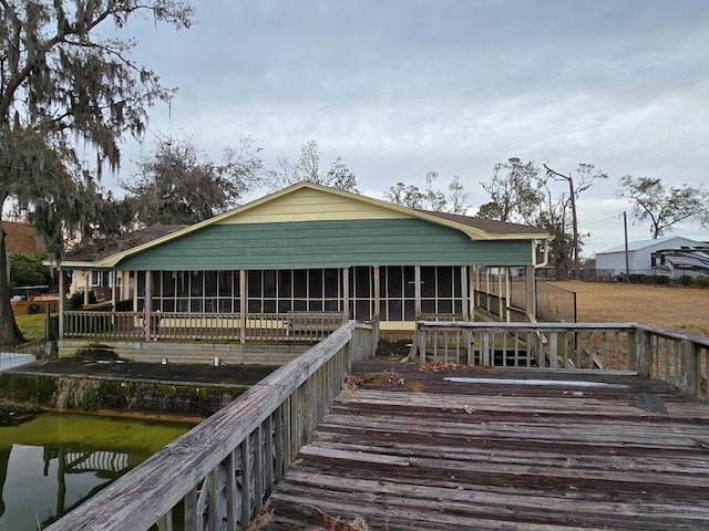 back of property featuring a sunroom