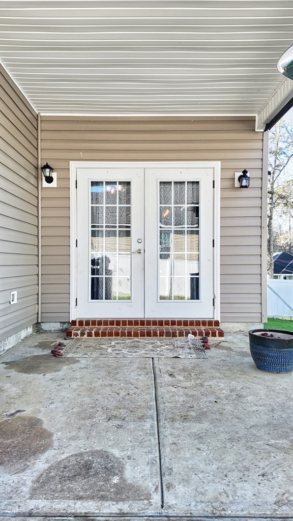 property entrance featuring french doors