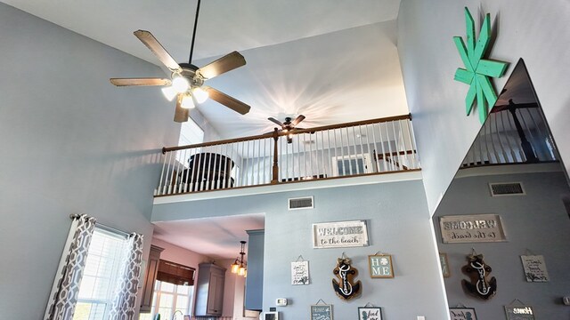 room details featuring visible vents and ceiling fan