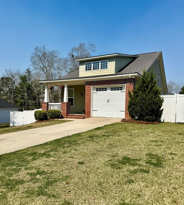 view of front of house featuring brick siding, fence, a porch, concrete driveway, and a front yard