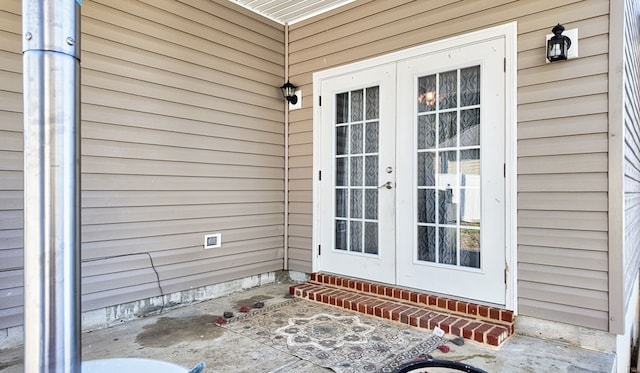 property entrance featuring french doors