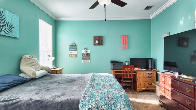 bedroom with visible vents, ceiling fan, crown molding, and carpet