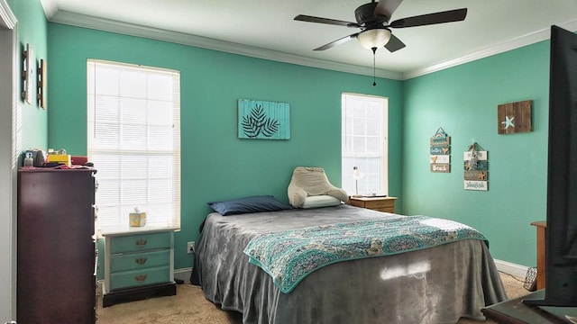 bedroom featuring ceiling fan, carpet, baseboards, and ornamental molding