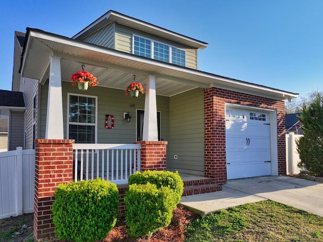 view of front of property featuring a porch, an attached garage, brick siding, and concrete driveway