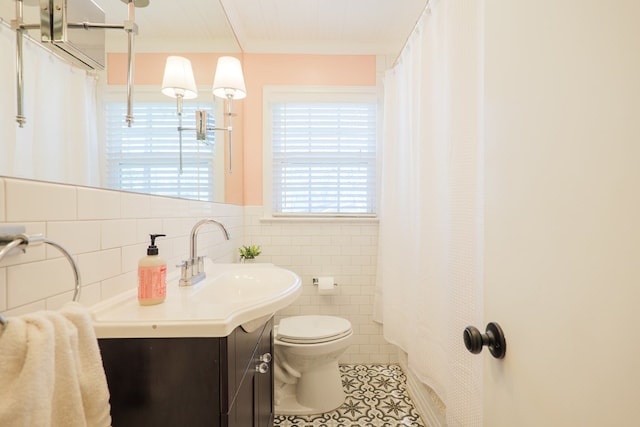 full bath featuring vanity, a shower with curtain, tile patterned flooring, tile walls, and toilet