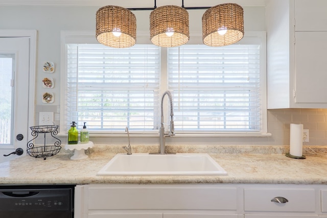 interior details featuring a sink, light countertops, white cabinets, dishwasher, and backsplash