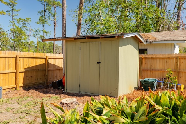 view of shed featuring a fenced backyard