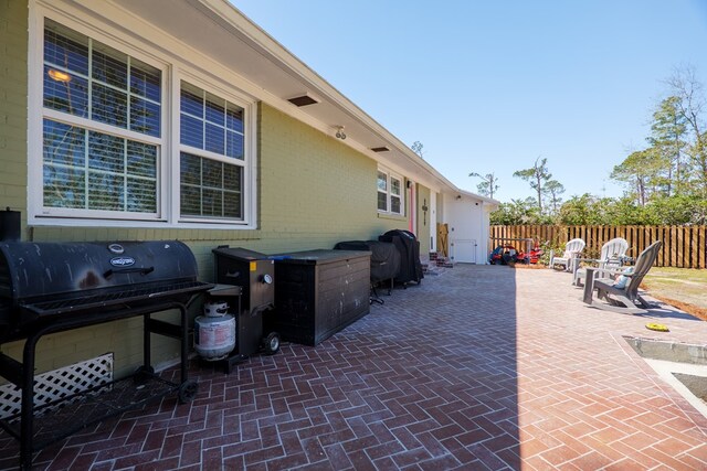 view of patio / terrace featuring area for grilling and fence