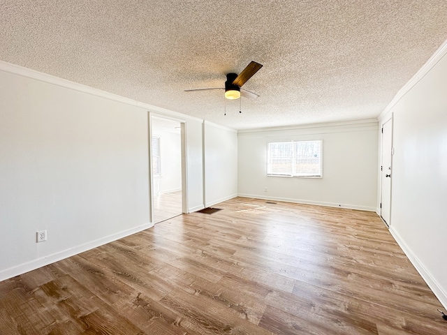 unfurnished bedroom featuring ceiling fan, ornamental molding, and light hardwood / wood-style flooring