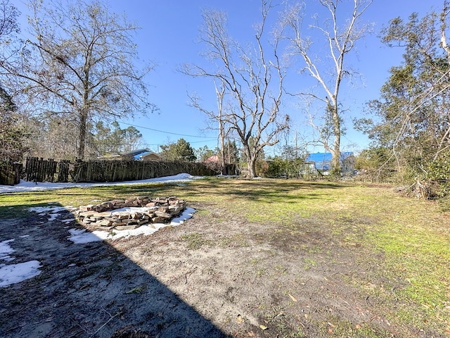 view of yard featuring an outdoor fire pit