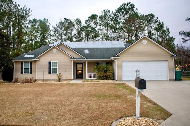 single story home featuring a garage and a front yard