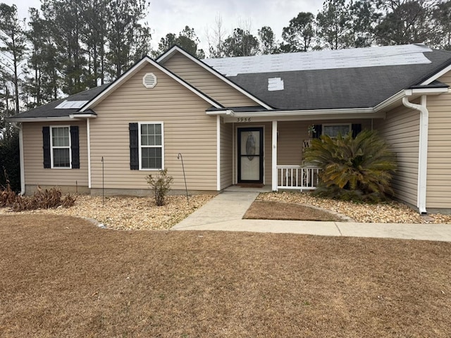 view of front of property with a front yard and a porch