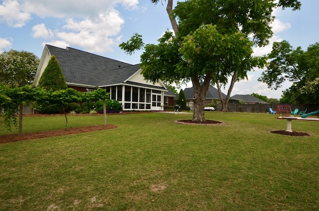 3854 Orchard Way, Valdosta, GA 31605 - view of yard with a sunroom and a playground