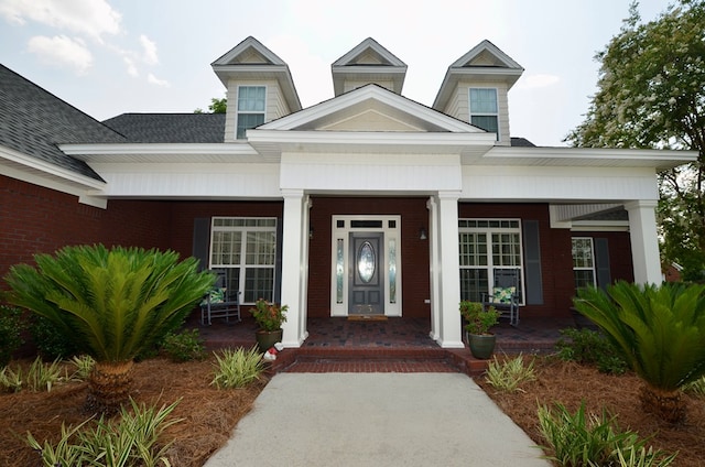 3854 Orchard Way, Valdosta, GA 31605 - view of exterior entry featuring a porch and brick siding