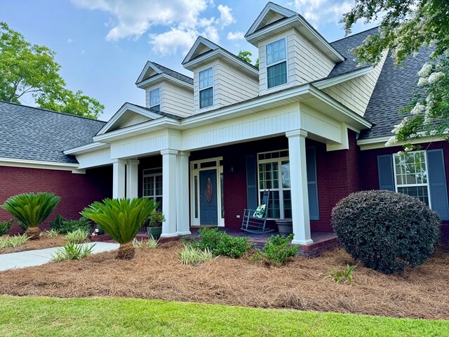 3854 Orchard Way, Valdosta, GA 31605 - view of front of property featuring covered porch, a shingled roof, and brick siding