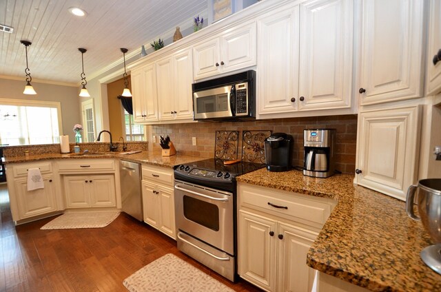 3854 Orchard Way, Valdosta, GA 31605 - kitchen with appliances with stainless steel finishes, a sink, crown molding, dark wood finished floors, and a peninsula