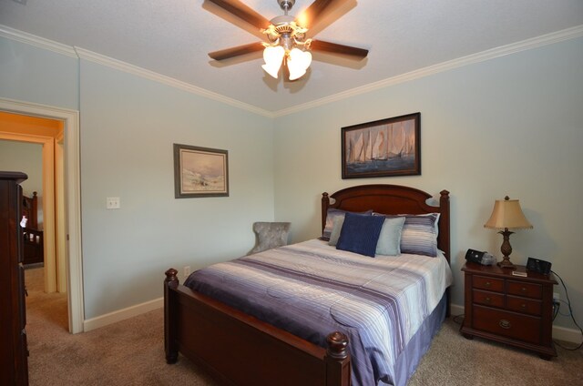 3854 Orchard Way, Valdosta, GA 31605 - carpeted bedroom featuring ornamental molding, baseboards, and a ceiling fan