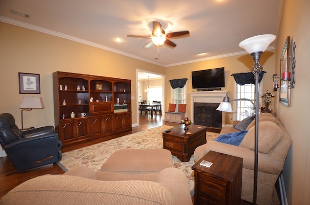 3854 Orchard Way, Valdosta, GA 31605 - living room with a ceiling fan, crown molding, wood finished floors, and a fireplace