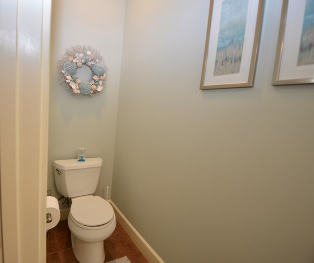 3854 Orchard Way, Valdosta, GA 31605 - bathroom featuring tile patterned flooring, toilet, and baseboards