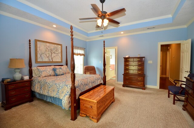 3854 Orchard Way, Valdosta, GA 31605 - carpeted bedroom with a tray ceiling, ornamental molding, ceiling fan, ensuite bathroom, and baseboards