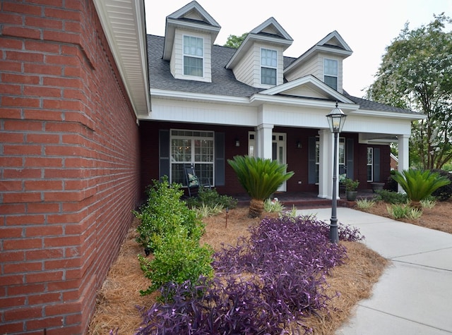 3854 Orchard Way, Valdosta, GA 31605 - cape cod home featuring covered porch and roof with shingles