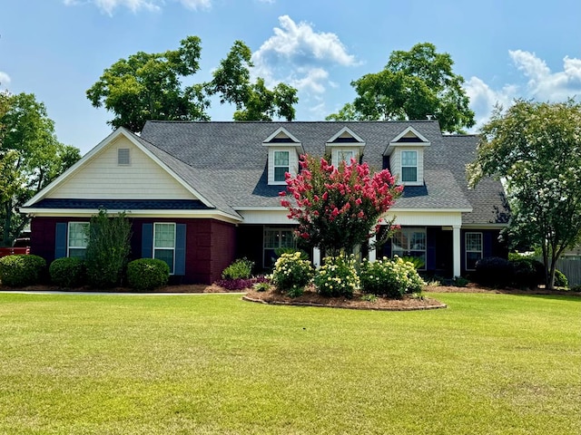 3854 Orchard Way, Valdosta, GA 31605 - cape cod-style house featuring a front lawn and roof with shingles