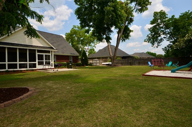 3854 Orchard Way, Valdosta, GA 31605 - view of yard with a playground and a sunroom