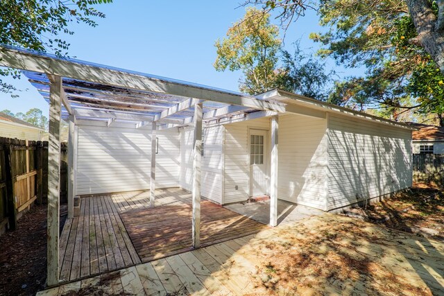 back of house with a wooden deck