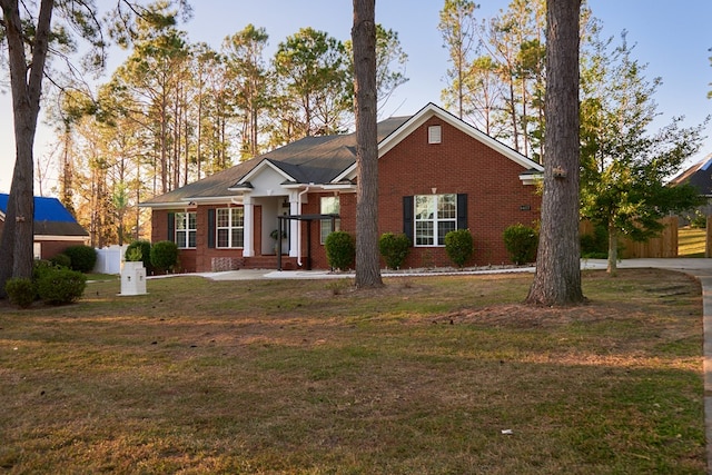 single story home with a front yard