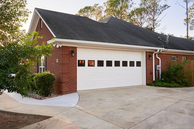 view of side of home featuring a garage