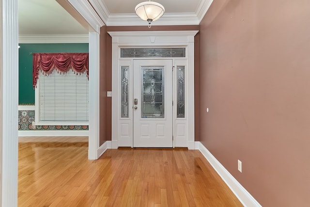 entrance foyer featuring light wood-type flooring and ornamental molding