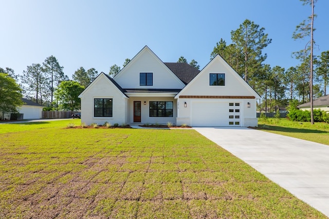 modern inspired farmhouse with concrete driveway, fence, a front lawn, and a garage