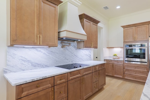 kitchen with custom exhaust hood, oven, crown molding, black electric stovetop, and decorative backsplash