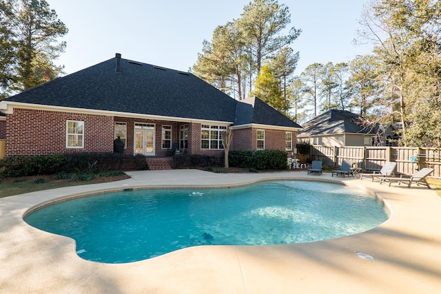 view of pool with a patio area and french doors