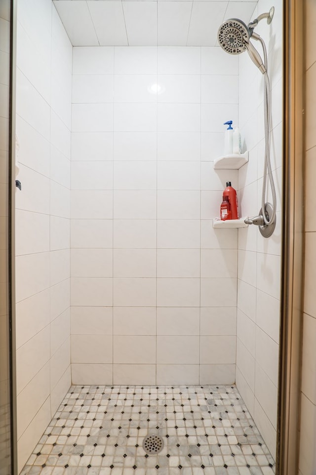 bathroom with tiled shower