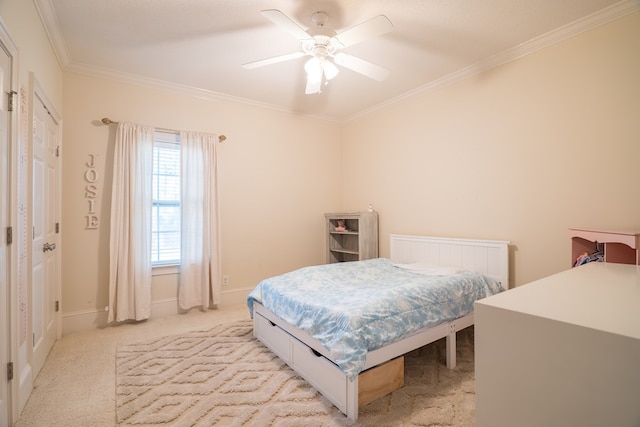 carpeted bedroom with ceiling fan and crown molding