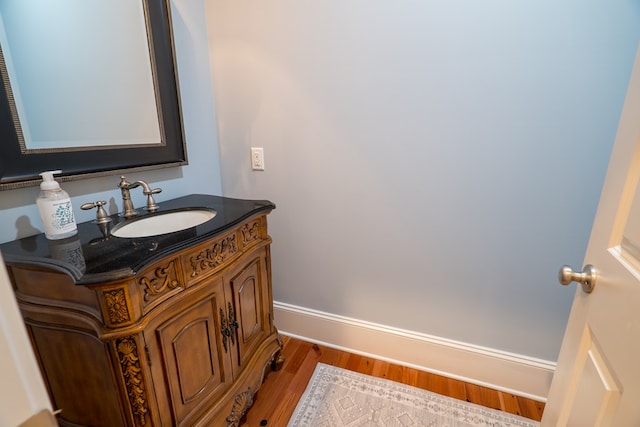 bathroom featuring vanity and hardwood / wood-style flooring