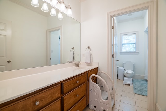 bathroom featuring toilet, tile patterned floors, and vanity