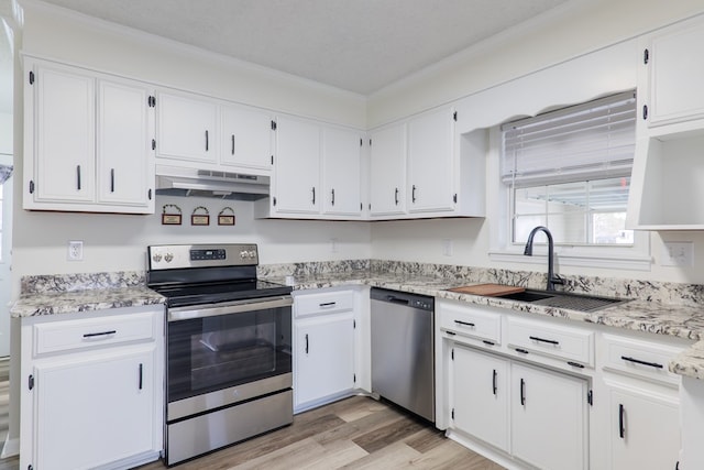 kitchen featuring sink, white cabinets, and stainless steel appliances