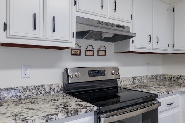 kitchen with white cabinets and stainless steel range with electric stovetop