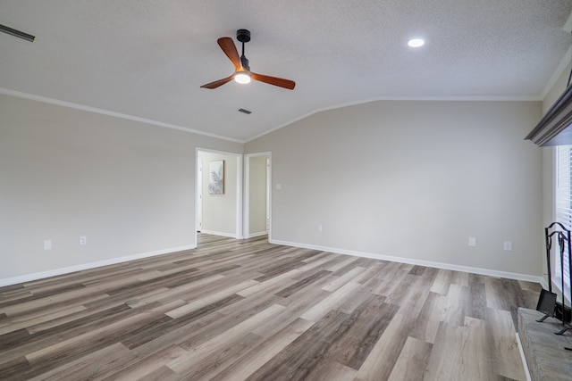 unfurnished living room featuring a textured ceiling, ceiling fan, crown molding, light hardwood / wood-style flooring, and lofted ceiling