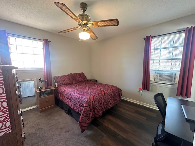 bedroom with baseboards, a textured ceiling, ceiling fan, and wood finished floors