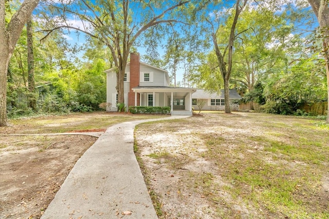 view of front of house featuring a porch and a front yard